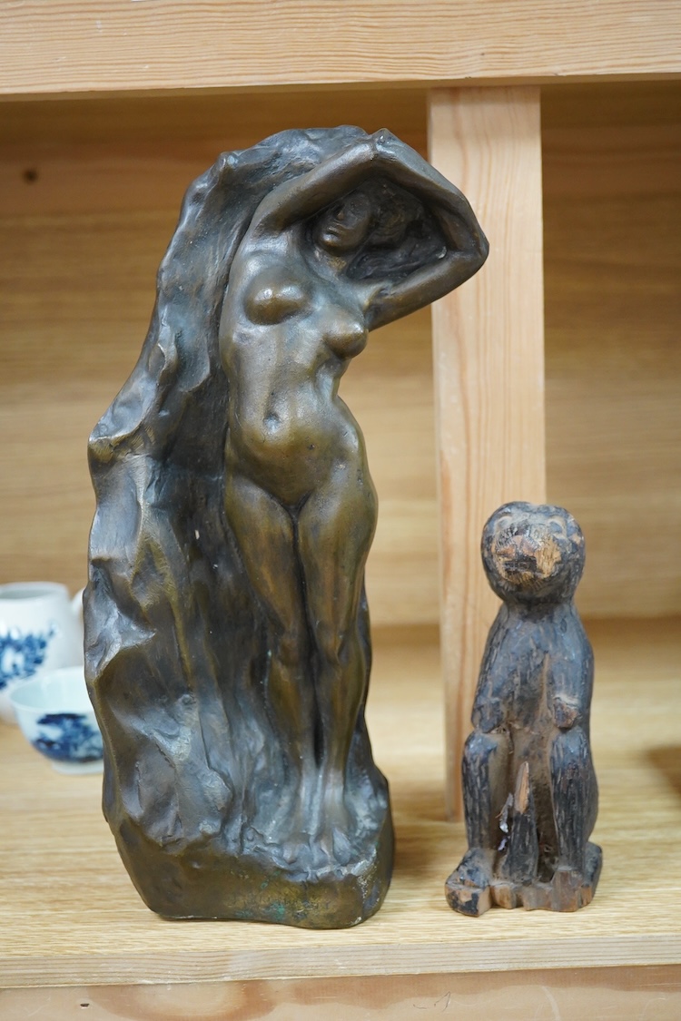 A contemporary bronze figure of a standing female nude, indistinctly signed and a card wood figure of a bear, tallest 29.5cm